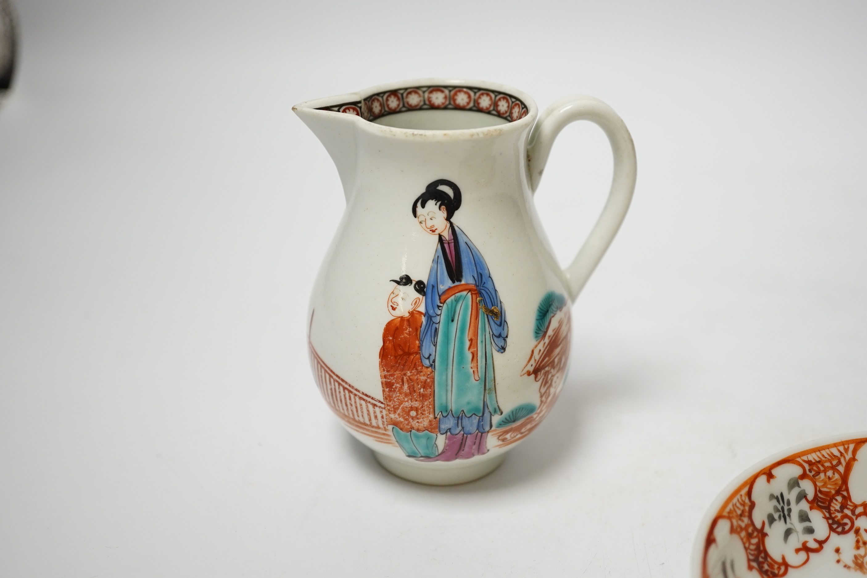 A Worcester sparrowbeak jug and a similar coffee cup together with an 18th century Chinese export saucer, 13cm diameter